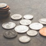 coins on gray surface